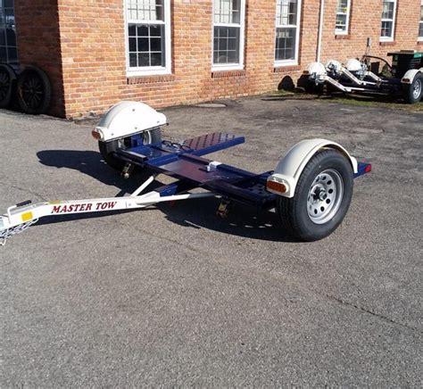 The dolly has two sets of straps, one for tall tires (came with it when hey bought it) and a set for smaller tires the bought for the car they towed. . Tow dolly for sale used